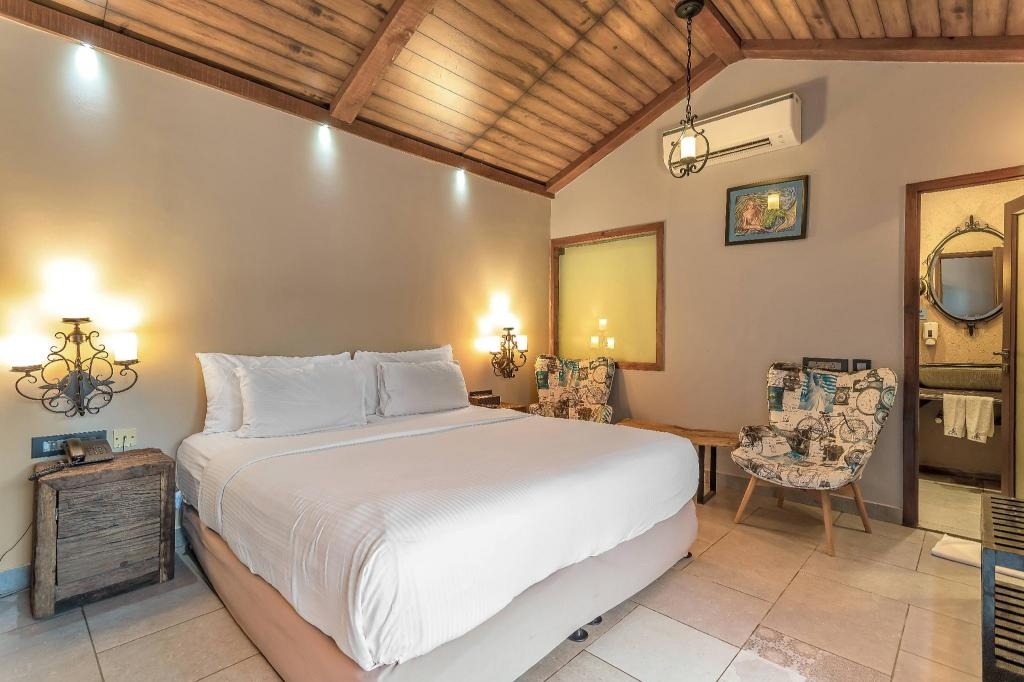 The Baga Beach Resort  Rooms  Pool Side Cottage Bed 14   Copy